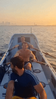 Curious Dolphins Join Rowers' Early Morning Training
