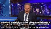 shooting jon stewart GIF
