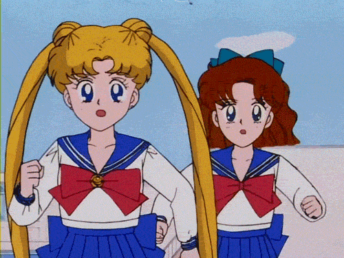 Anime gif. Running late, a worried Sailor Moon and Sailor Mercury jog quickly to make up time.
