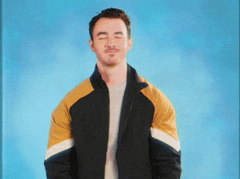 Celebrity gif. Kevin Jonas from the Jonas Brothers golf claps against an airbrushed blue background.