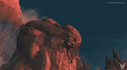 A character climbing a steep, rocky cliff. The character is equipped with climbing gear, including ropes and a harness. They ascend the red-hued rocks with determination. The background features a dramatic, rugged landscape under a deep blue sky, with other rock formations visible in the distance.