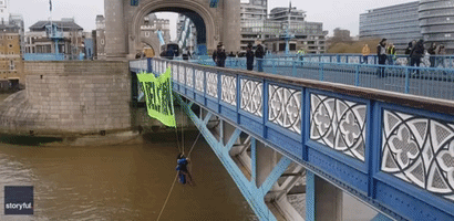 Extinction Rebellion Activist Dangles From London's Tower Bridge