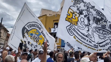 Fans Gather Outside Santos Stadium for Pele's Funeral Procession