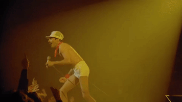 performing freddie mercury GIF
