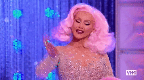 Reality TV gif. Christina Aguilera blows a kiss to contestants on RuPaul's Drag Race.