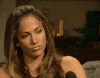 Celebrity gif. Jennifer Lopez purses her lips as if in thought as she stares ahead. 