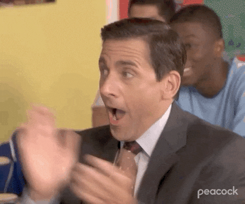 The Office gif Steve Carell as Michael Scott claps his hands vigorously as the camera zooms in on his face Hes obviously excited mouthing wow over and over 