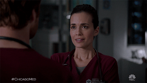 TV gif. Torrey DeVitto as Natalie in Chicago Med rushes toward Nick Gehlfuss as Will before they embrace each other tenderly.