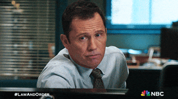 Nbc Shrug GIF by Law & Order