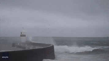 Dramatic Moment Waves Crash Over Lighthouse as Storm Gerrit Rages