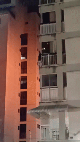 Girl Lowered Down From Building on Fire in Caracas