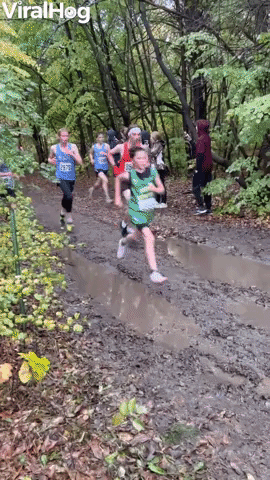 Athlete Dives Into Mud Puddle During Race