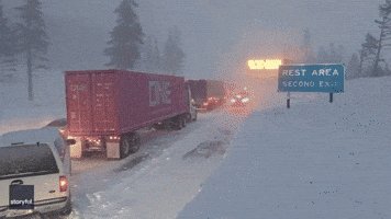 Cars Surrounded by Deep Snowbanks as Storm Causes Gridlock on California Highway
