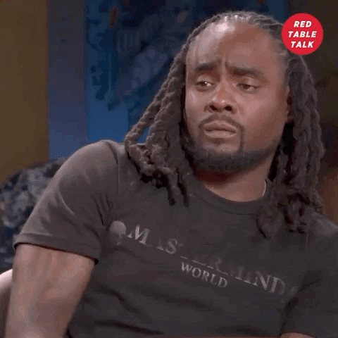 TV gif. On an episode of "Red Table Talk," a man with dreadlocks motions with his hand to his chest, then raises it in the air as if to say, "me!"