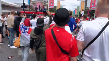 England Fans Jump on Roof of Bus Outside Wembley Stadium