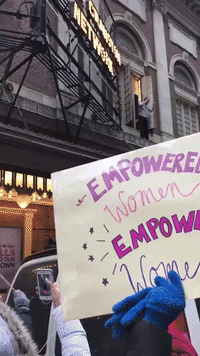 Bryan Cranston Cheers New York Women's March From Window Ledge