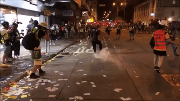 Protesters Stomp Out Tear Gas and Burn 'Ghost Money' in Hong Kong's Sham Shui Po