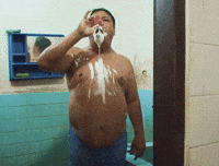 man brushing GIF
