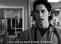 TV gif. Zach Braff as J.D. in Scrubs. In black and white, he stares us down with full compassion and intention as he says, "I miss you so much it hurts sometimes."