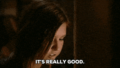 Reality TV gif. Audrina Patridge on The Hills has her cheeks stuffed with food and she chews as she says, “It’s really good.”