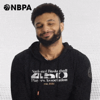 Video gif. Jamal Murray of the Denver Nuggets poses for a NBA Players Association ad, smiling and nodding his head as text flies in, "Nah."