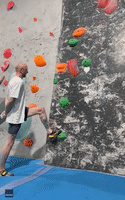 Climber Scales Wall With Hands Behind His Back