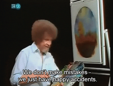 A man is smiling while painting in a canvas. Text on the screen reads, "We don't make mistakes - we just have happy accidents."