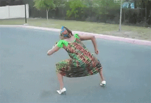 Video gif. Woman in a dress and headwrap and wearing white heels dances earnestly, pumping her arms up and down as she squats down.