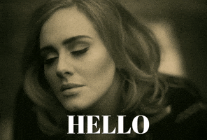 Celebrity gif. Adele is shot from above and her face is upturned with her eyes closed. She opens them and the text reads, "Hello."