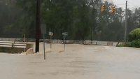 Creek Rushes Over Road in Columbia, S.C.