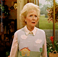 TV gif. Actress Betty White as Rose in Golden Girls collapses dramatically onto the sofa as if fainting. 