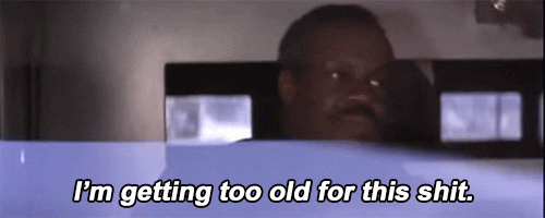 Video gif. Danny Glover as Roger Murtaugh in Lethal Weapon appears to be in a moving vehicle as he slightly shakes his head, looking exasperated, and says, "I'm getting too old for this shit."