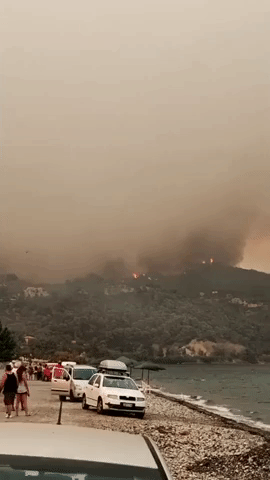 Wildfire Towers Over Limni, Greece, Ahead of Mass Evacuation