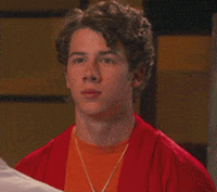 serious nick jonas GIF