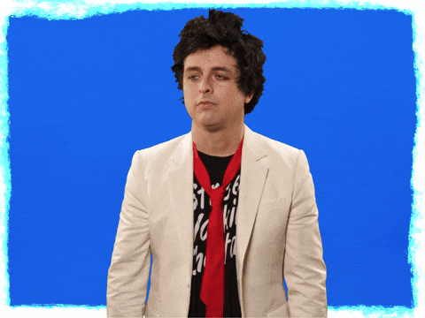 News Sebrae - Edição 54 - GIF de homem com gravata vermelha, camiseta preta e blazer bege, colocando a mão no rosto.