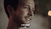 the resident smile GIF