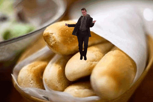 Photo gif. A video of Chandler from Friends dancing goofy on top of an image of a basket of breadsticks.