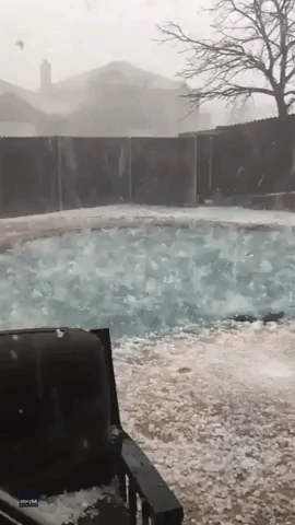 Large Hailstones Smash into Pool in Texas Backyard