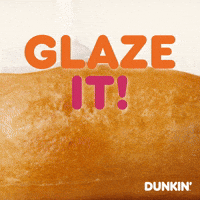 Sponsored gif. Close-up of a fried donut being glazed. The glaze oozes down the sides. Text over it reads, “Glaze it!”