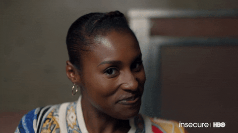 TV gif. Issa Rae on Insecure smiles at us and shimmies her shoulders side to side.