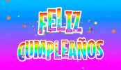 Text gif. Rainbow-colored block lettering pops up against a blue, purple, and pink gradient background and reads, in Spanish, "Feliz cumpleaños."