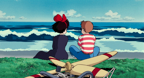 two animated boy and girl sit by the beach