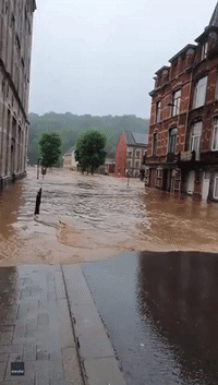 Man Smashes Wall to Save Elderly Woman Trapped in Flooded Building in Eastern Belgium