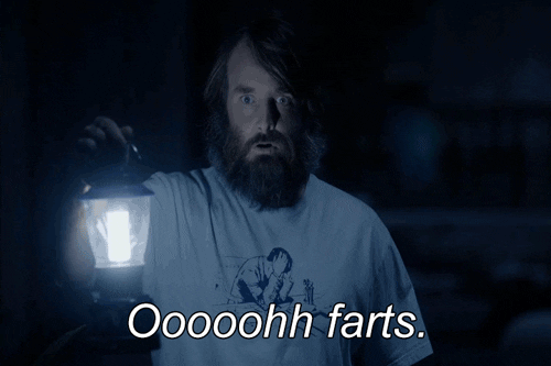 TV gif. Will Forte as Phil on The Last Man on Earth. He holds a lantern up in a dark room and stares at something in shock and he says, "Ooohhh farts."