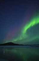 Aurora Borealis Glows Over River in Alaska