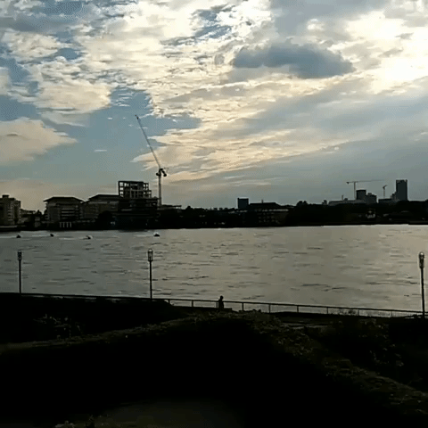 Police Boats Pursue Jet Skis Along the River Thames