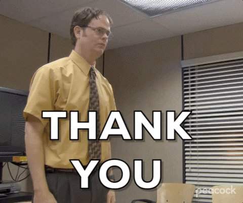 The Office gif. Rainn Wilson as Dwight stands in a conference room wearing a mustard-colored shirt. With a serious expression he says “Thank you.”