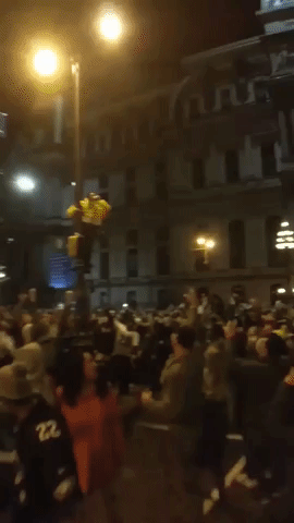 Eagles Fans Climb Lampposts to Celebrate 
