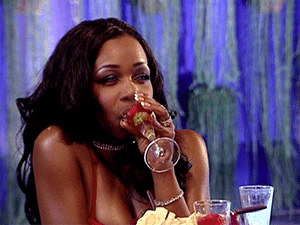 Reality TV gif. Tiffany “New York” Pollard on Flavor of Love sips on a cocktail while she rolls her eyes in annoyance.