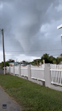 Large Funnel Cloud Whips Up Debris in Aguada, Puerto Rico